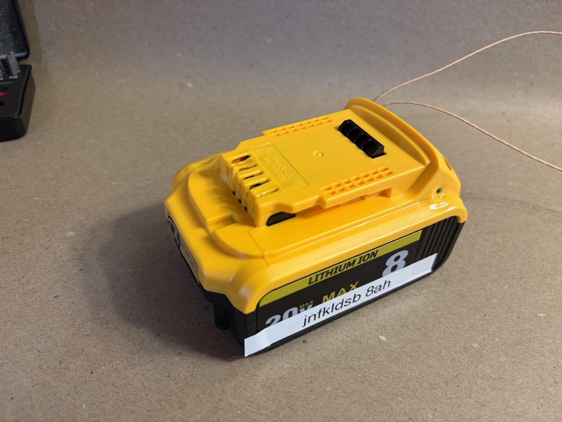 Visible pack deformation across enclosure after failure test