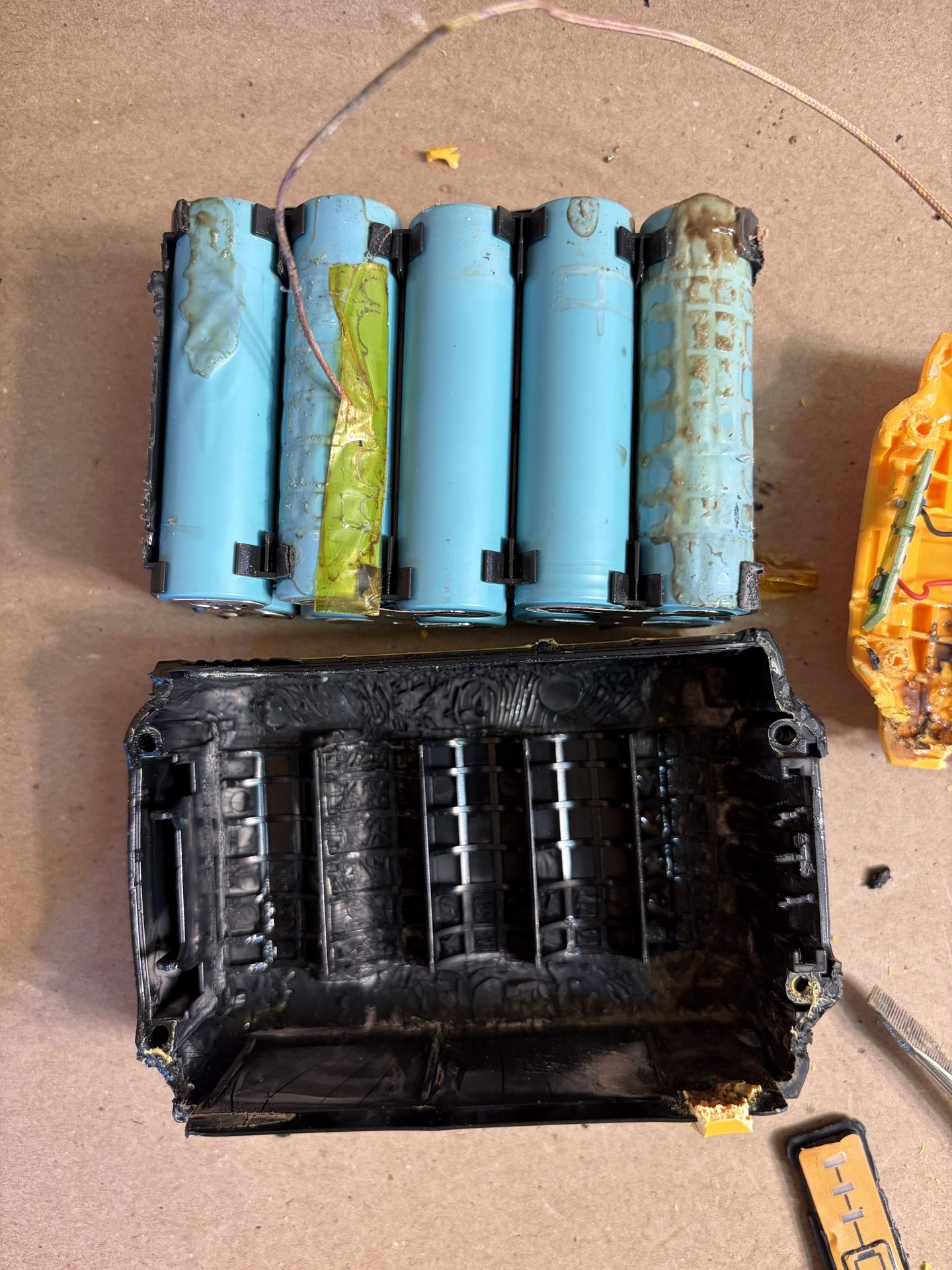 Cell ruptures and deformed bottom enclosure